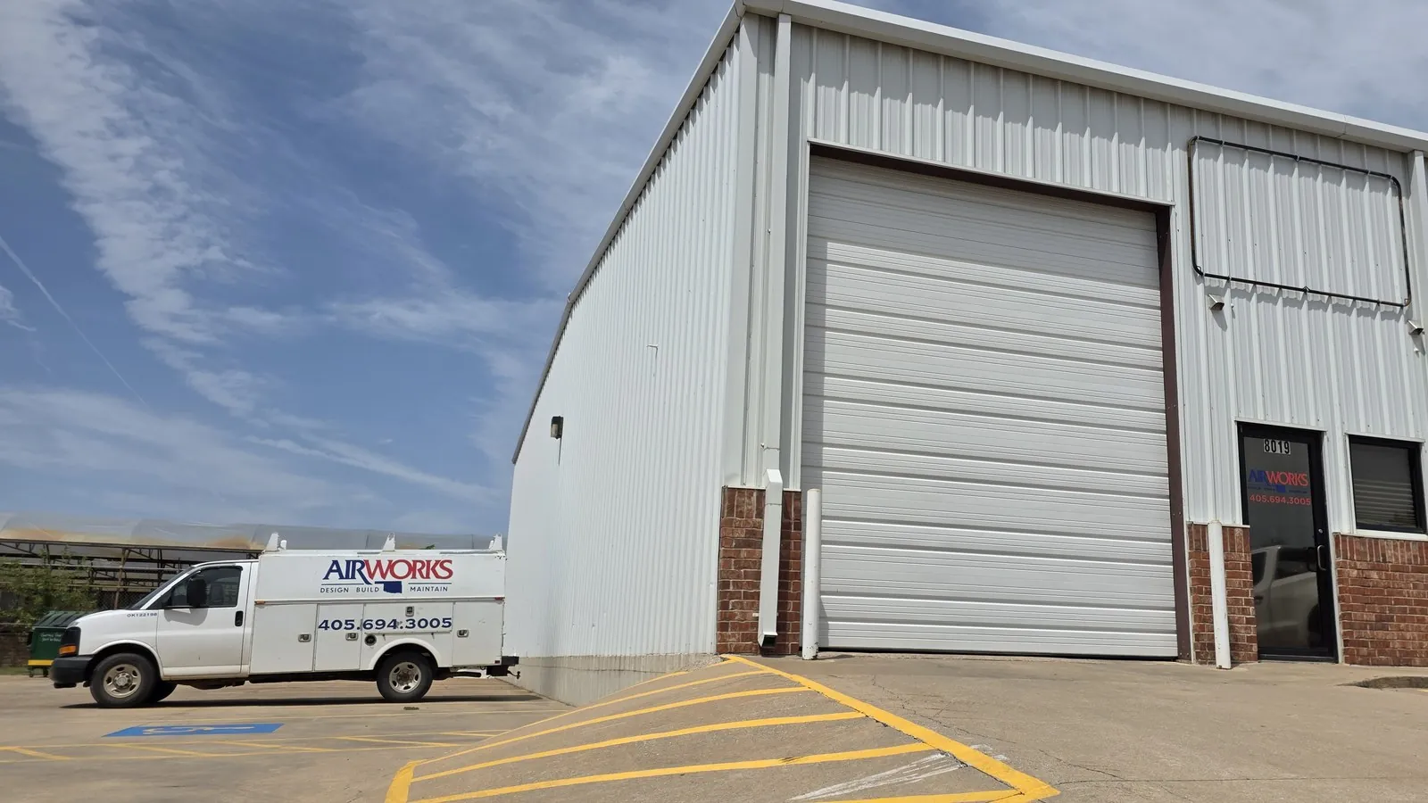 Air Works shop building and branded service van with logo and phone number visible, 8019 W. Reno Ave, Oklahoma City